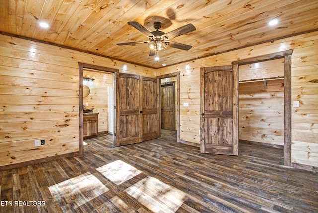 unfurnished bedroom featuring wood walls, wood ceiling, ensuite bathroom, and dark hardwood / wood-style flooring