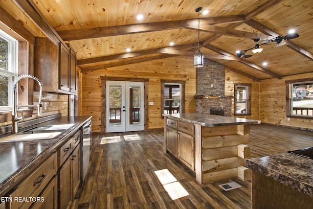 kitchen with french doors, a kitchen island, wooden walls, wooden ceiling, and dark hardwood / wood-style flooring