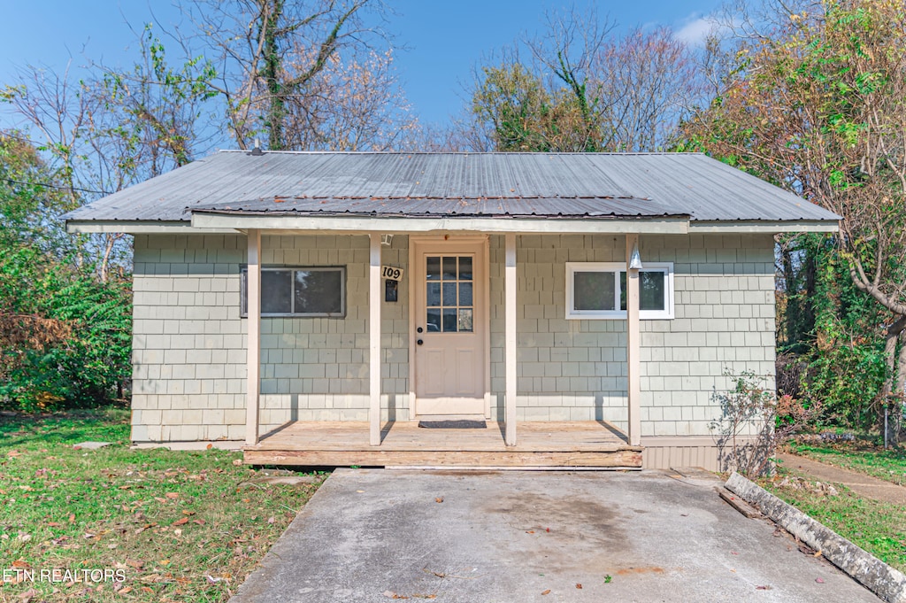 view of outbuilding featuring a porch