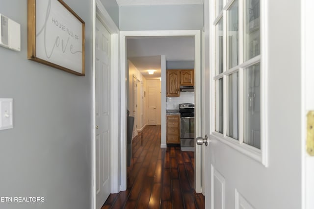 hallway with dark hardwood / wood-style floors