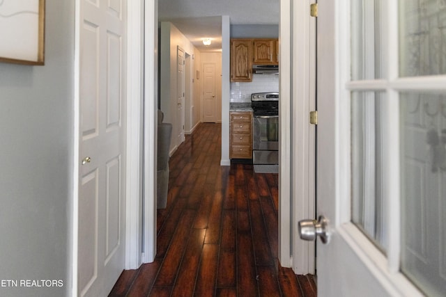 corridor featuring dark wood-type flooring