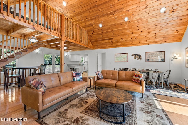 living room featuring hardwood / wood-style floors, wooden ceiling, and high vaulted ceiling