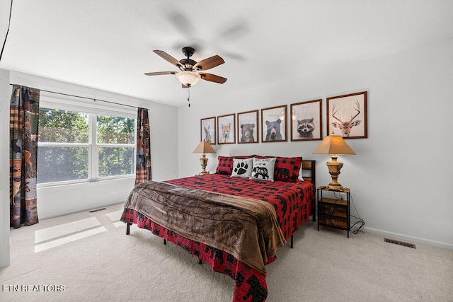 carpeted bedroom with ceiling fan