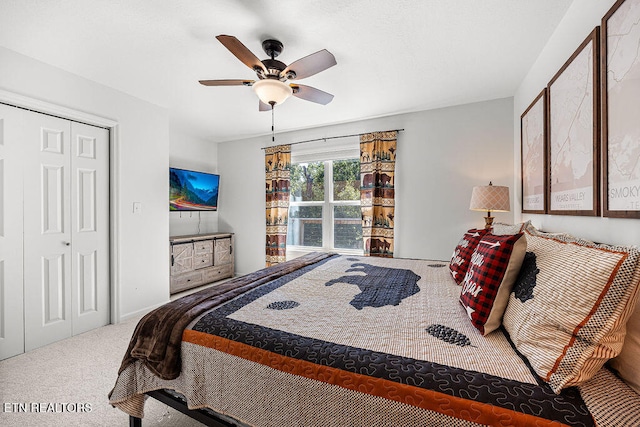 bedroom featuring carpet flooring, a closet, and ceiling fan