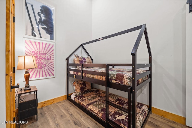 bedroom featuring hardwood / wood-style flooring