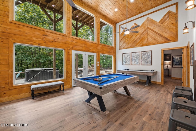 recreation room featuring hardwood / wood-style flooring, high vaulted ceiling, and wood ceiling