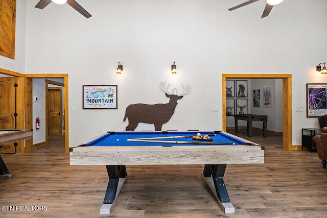 playroom featuring a high ceiling, ceiling fan, dark wood-type flooring, and pool table