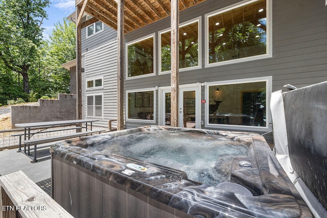 deck with a hot tub