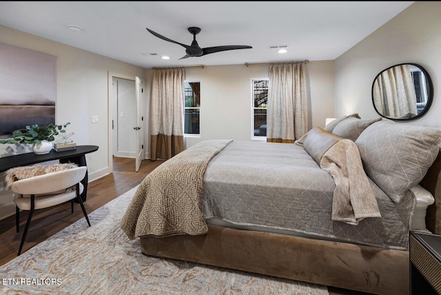 bedroom featuring hardwood / wood-style floors and ceiling fan