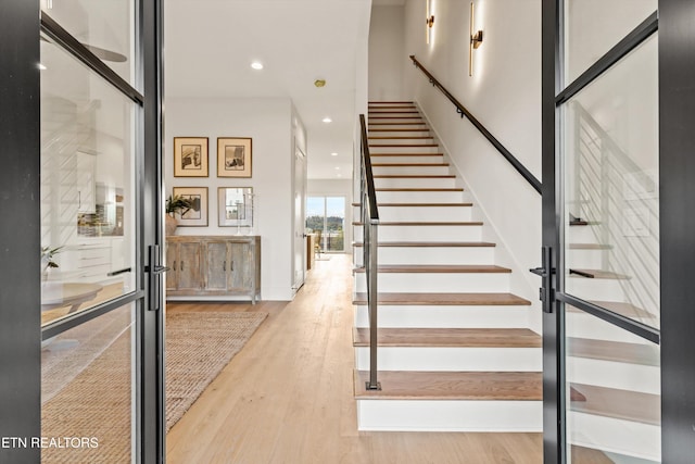 stairway featuring wood-type flooring