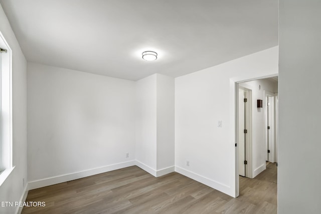 spare room with light wood-type flooring