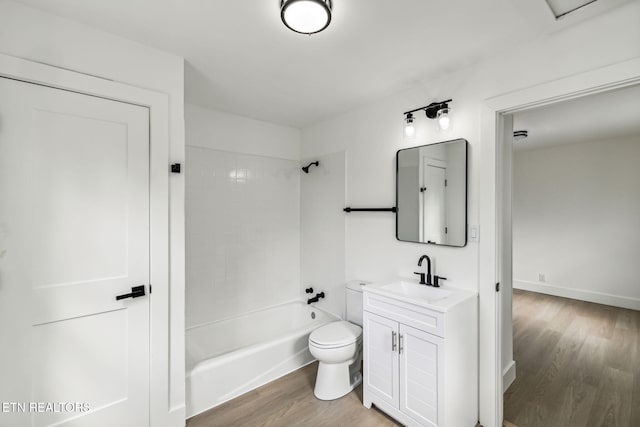 full bathroom featuring vanity, washtub / shower combination, wood-type flooring, and toilet