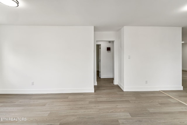 unfurnished room featuring light hardwood / wood-style flooring