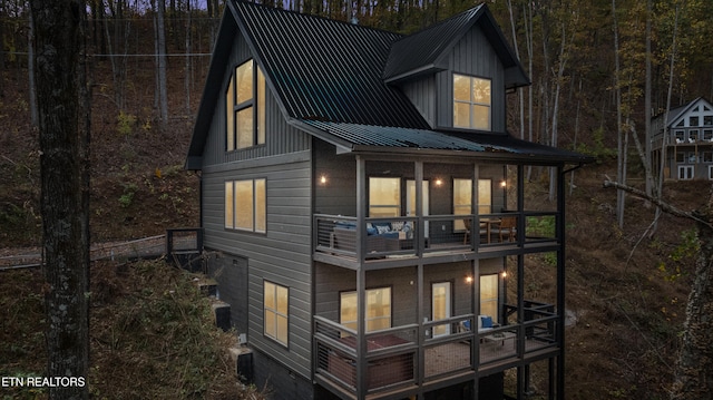 rear view of house featuring a balcony