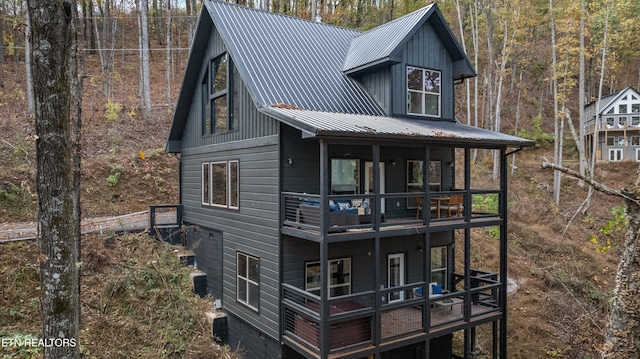 back of property with a balcony