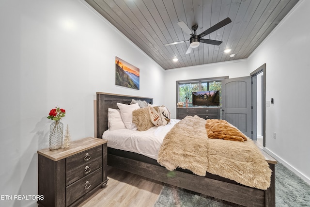 bedroom featuring ornamental molding, ceiling fan, and wooden ceiling