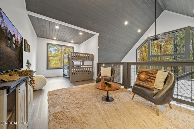 bedroom with high vaulted ceiling, light hardwood / wood-style flooring, and wood ceiling