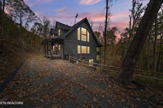 view of back house at dusk