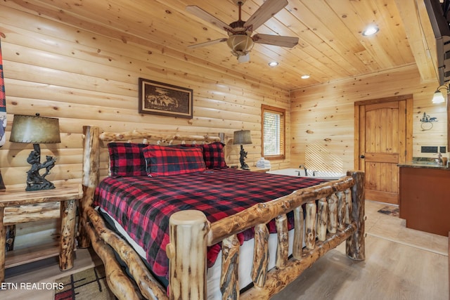 bedroom featuring light hardwood / wood-style floors, wood ceiling, and ceiling fan