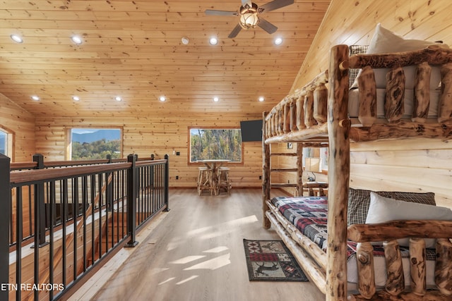 bedroom featuring multiple windows, vaulted ceiling, and wooden ceiling