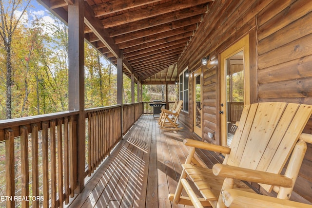 wooden terrace featuring grilling area