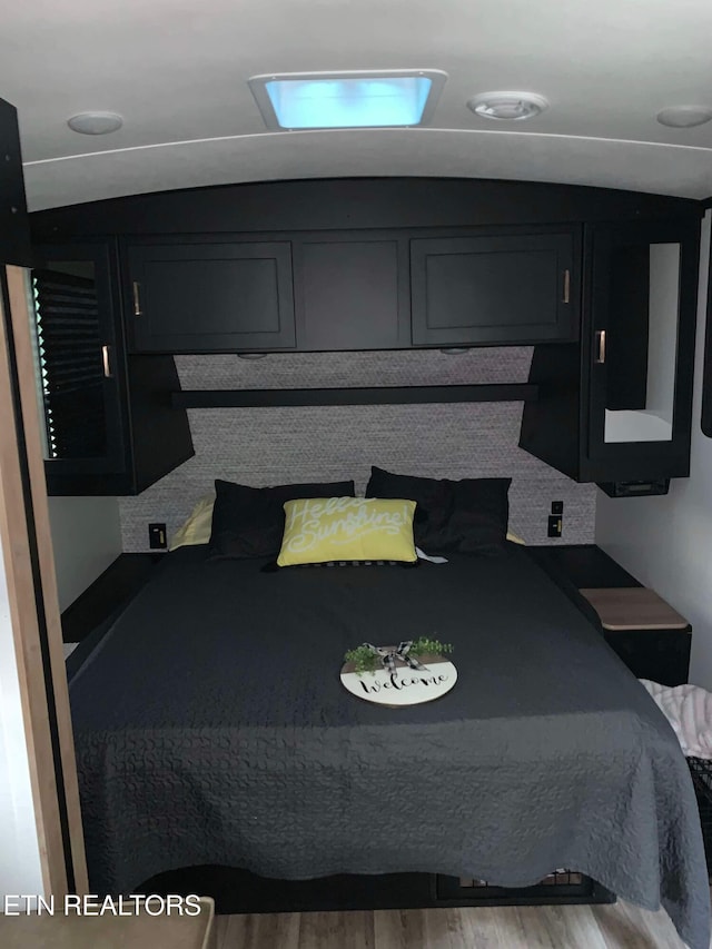 bedroom featuring wood-type flooring