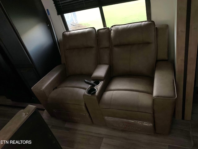 home theater room featuring hardwood / wood-style flooring