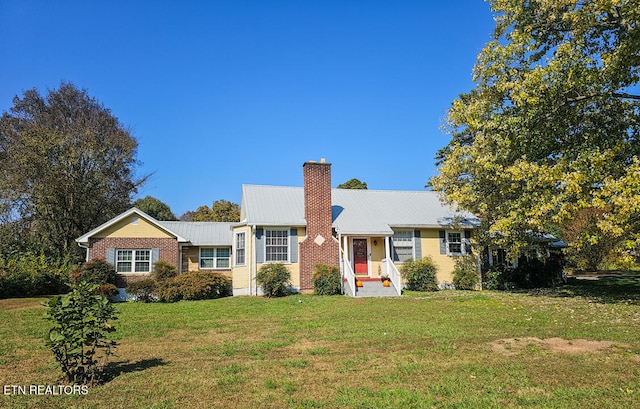 ranch-style house with a front lawn