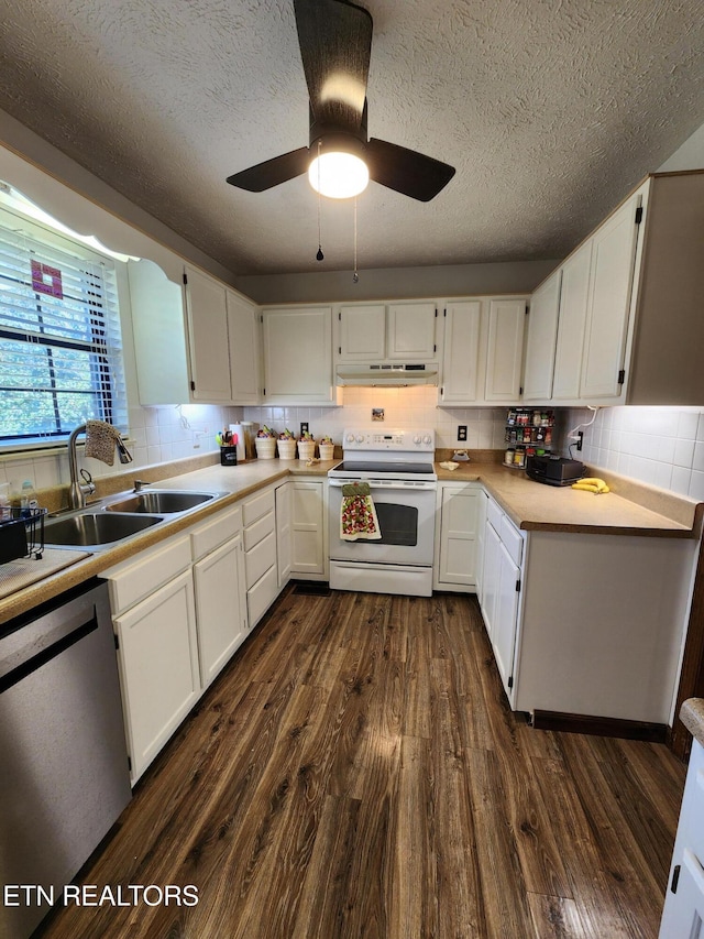 kitchen featuring dishwasher, sink, dark hardwood / wood-style flooring, white range with electric cooktop, and white cabinetry