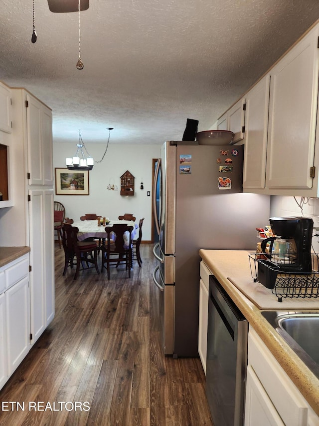 kitchen featuring dishwasher, white cabinets, a textured ceiling, and dark hardwood / wood-style flooring