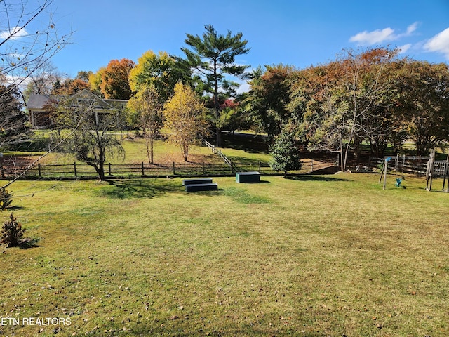 view of yard with a rural view