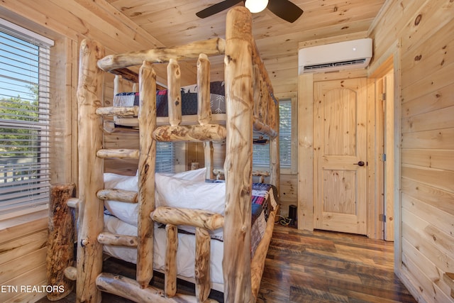 unfurnished bedroom with wooden walls, dark wood-type flooring, ceiling fan, and wooden ceiling