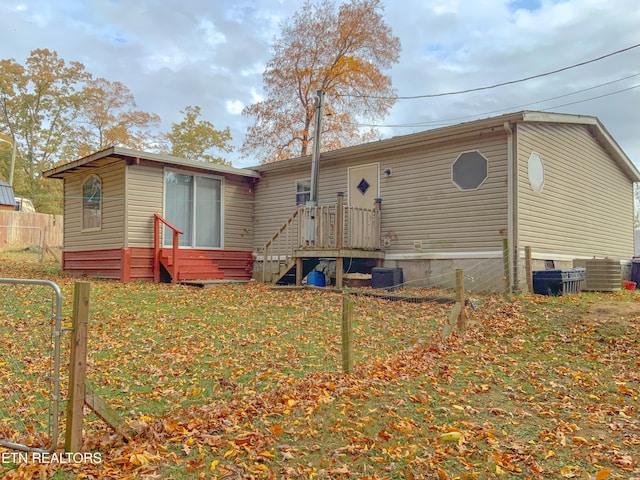 back of house with cooling unit