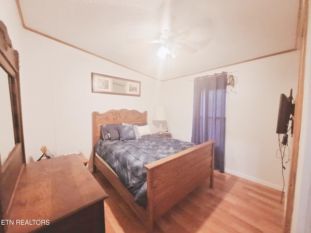 bedroom with light wood-type flooring and ceiling fan