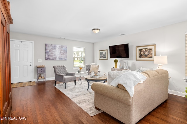 living room featuring dark wood-type flooring