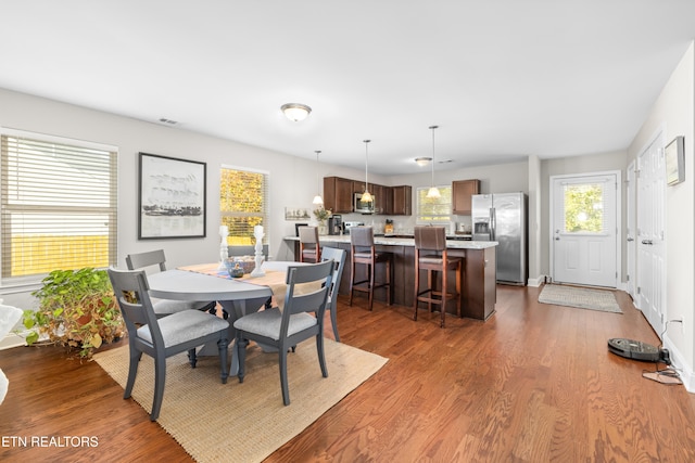 dining room with wood-type flooring