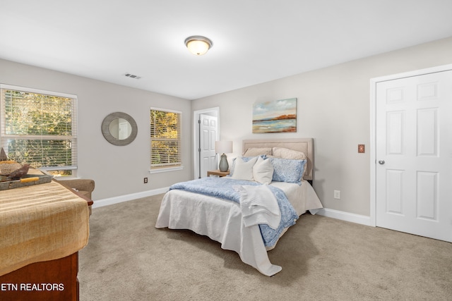 bedroom with light colored carpet