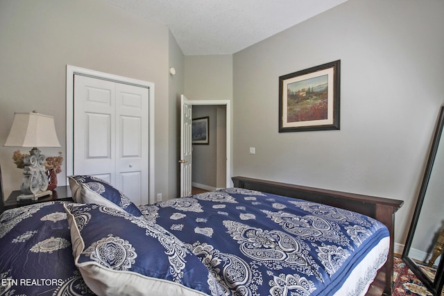 bedroom with a closet and a textured ceiling