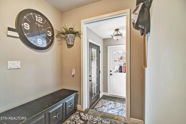 interior space with dark tile patterned flooring