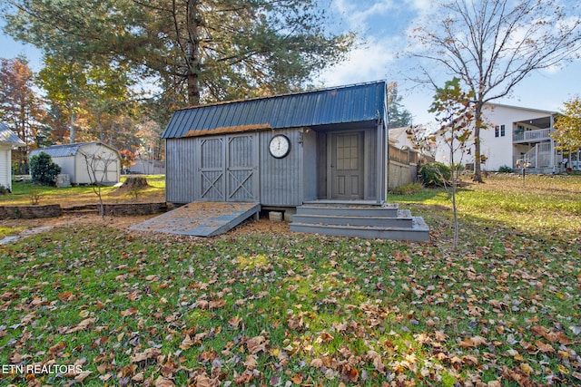 view of outdoor structure featuring a yard