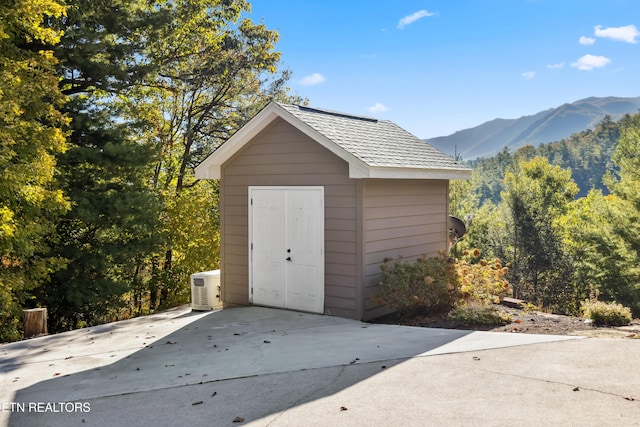 view of outdoor structure with a mountain view