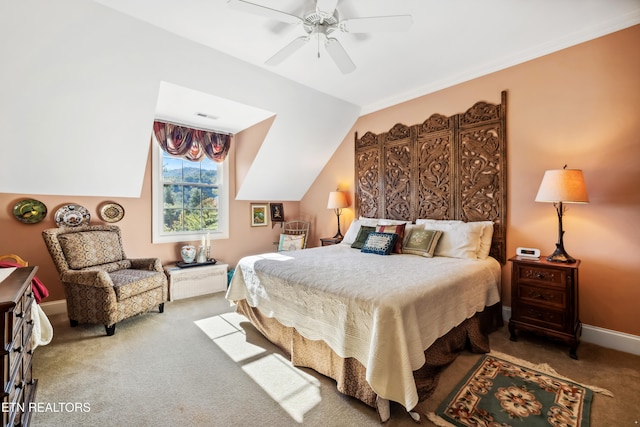 bedroom featuring carpet, vaulted ceiling, and ceiling fan