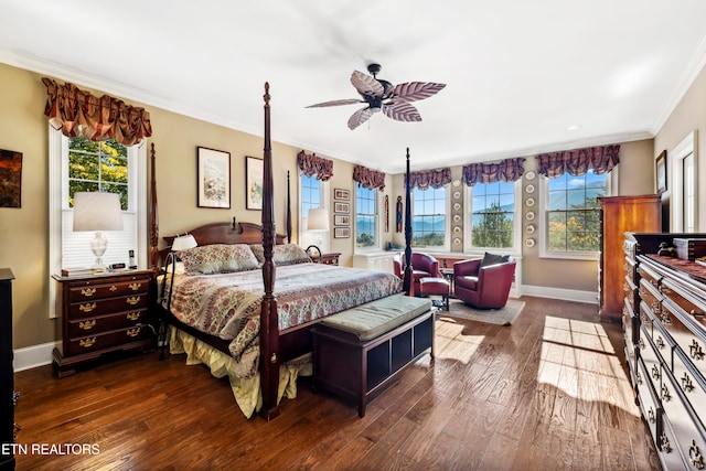 bedroom with ornamental molding, dark wood-type flooring, and ceiling fan