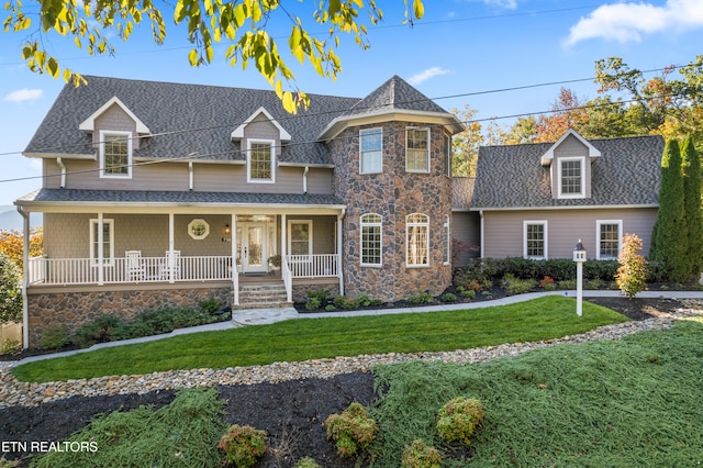 view of front of house featuring a front yard and a porch