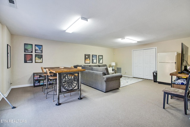 living room with a textured ceiling