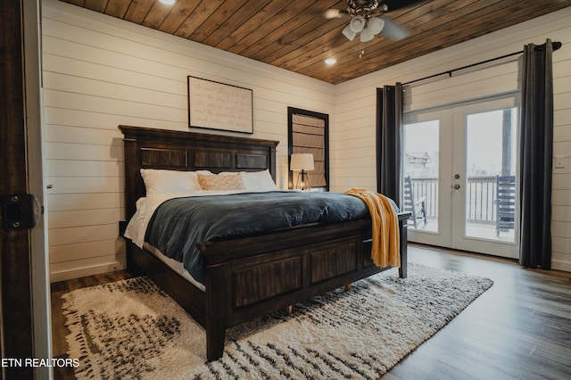 bedroom with wood walls, access to outside, wood-type flooring, french doors, and wooden ceiling