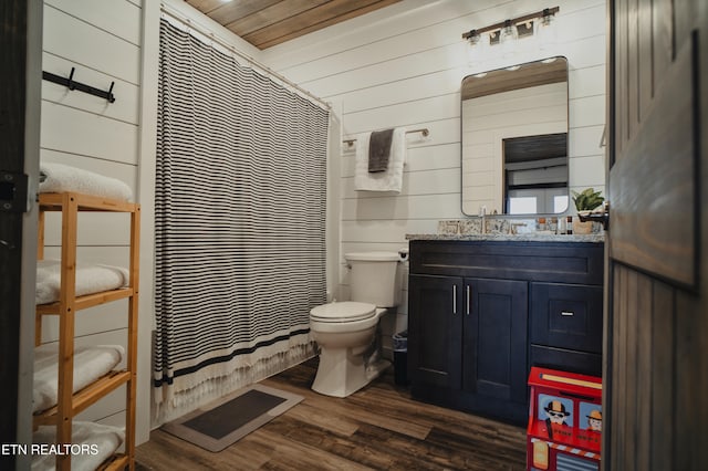 bathroom featuring toilet, wooden walls, wood-type flooring, wooden ceiling, and vanity