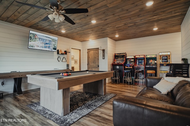 rec room with wooden walls, wood ceiling, and hardwood / wood-style flooring