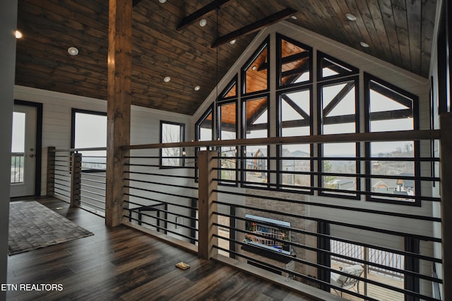 hall featuring wood ceiling, dark hardwood / wood-style flooring, high vaulted ceiling, beamed ceiling, and wooden walls