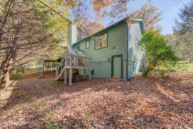 54 Heather Glen Ct, Crossville, TN 38558 - back of property with a wooden deck, a chimney, stairs, and crawl space
